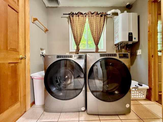 18611 327th Ave, Isle, MN 56342 - washroom with tankless water heater, light tile patterned floors, and independent washer and dryer