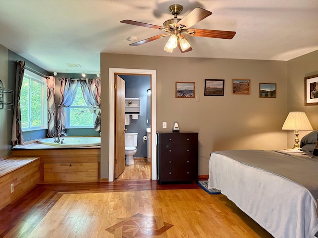 18611 327th Ave, Isle, MN 56342 - bedroom with wood finished floors, ensuite bathroom, and ceiling fan