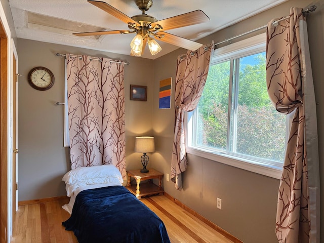 18611 327th Ave, Isle, MN 56342 - bedroom featuring light wood-style flooring and a ceiling fan