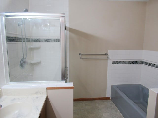 13437 Zarthan Ave S, Savage, MN 55378 - bathroom with vanity, a bath, and tiled shower