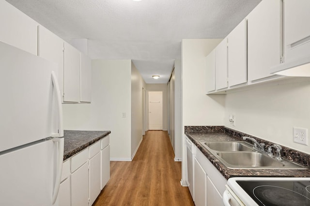 4130 Rahn Rd Unit 310, Eagan, MN 55122 - kitchen featuring white appliances, white cabinetry, dark countertops, and light wood-type flooring