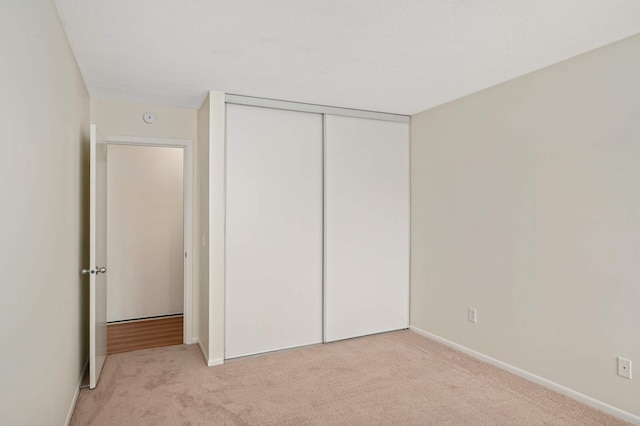 4130 Rahn Rd Unit 310, Eagan, MN 55122 - unfurnished bedroom featuring light carpet and a closet