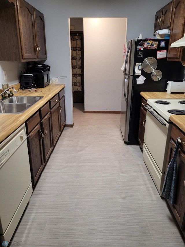 2402 18th St S Unit 3, Fargo, ND 58103 - kitchen with white appliances, light countertops, and dark brown cabinetry