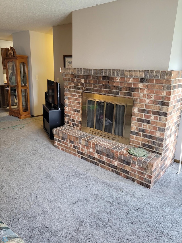 2402 18th St S Unit 3, Fargo, ND 58103 - living area with carpet and a brick fireplace