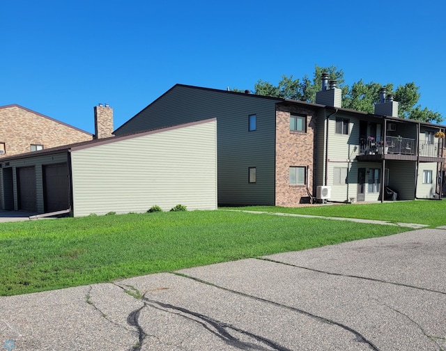 2402 18th St S Unit 3, Fargo, ND 58103 - view of property with concrete driveway and an attached garage
