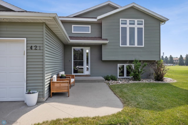 421 2nd Ave S, Kindred, ND 58051 - property entrance featuring a lawn and an attached garage