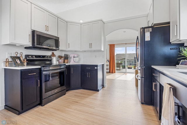 421 2nd Ave S, Kindred, ND 58051 - kitchen featuring stainless steel appliances, light wood finished floors, light countertops, and white cabinets