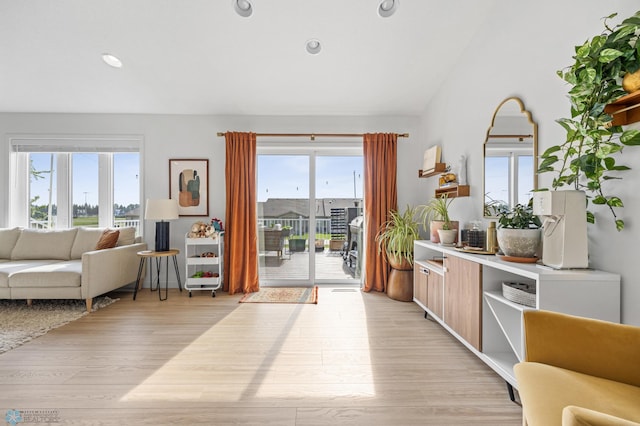 421 2nd Ave S, Kindred, ND 58051 - living room featuring light wood-style floors, lofted ceiling, and recessed lighting