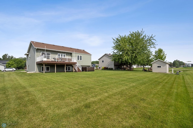 421 2nd Ave S, Kindred, ND 58051 - rear view of house featuring a wooden deck, a yard, and stairs