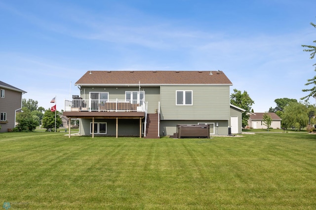 421 2nd Ave S, Kindred, ND 58051 - back of property with a wooden deck, a lawn, and a hot tub