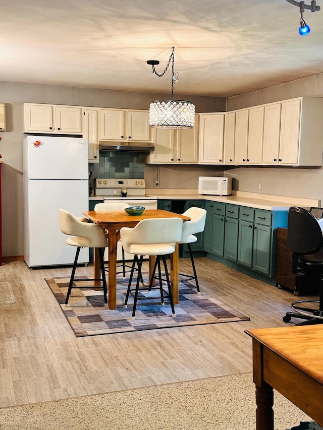 1414 E Shore Dr, Edgewater, WI 54817 - kitchen with white appliances, green cabinets, light countertops, pendant lighting, and backsplash