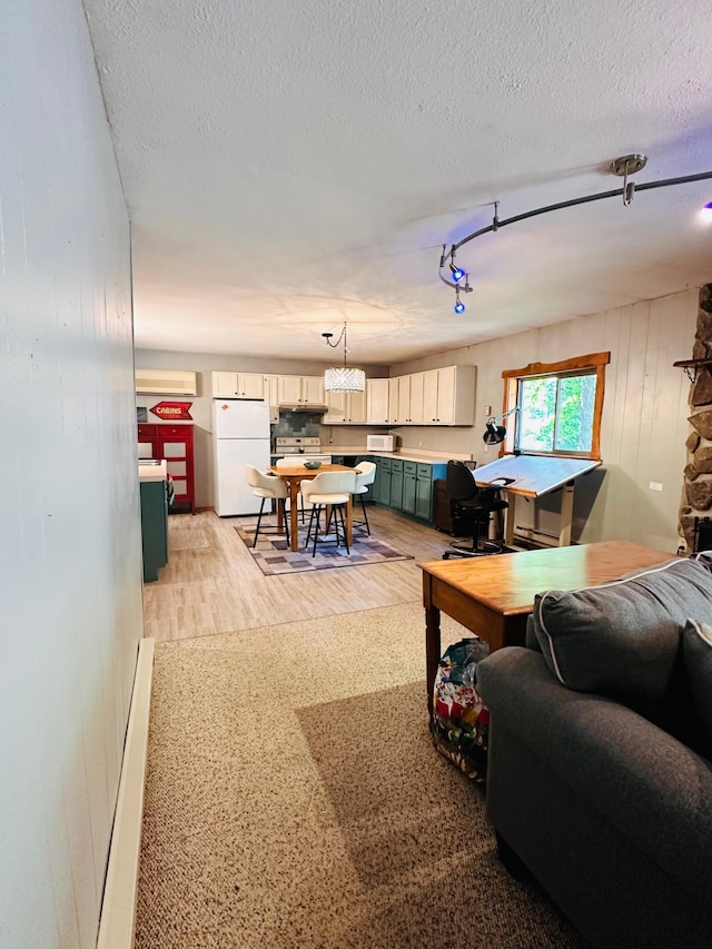 1414 E Shore Dr, Edgewater, WI 54817 - living room with light wood finished floors, a textured ceiling, a chandelier, and wooden walls