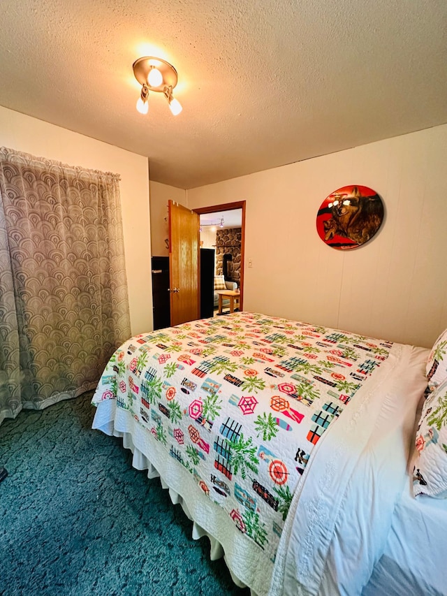 1414 E Shore Dr, Edgewater, WI 54817 - carpeted bedroom with a textured ceiling