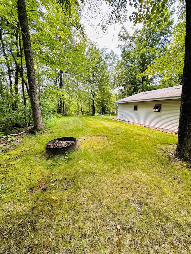 1414 E Shore Dr, Edgewater, WI 54817 - view of green lawn with an outdoor fire pit