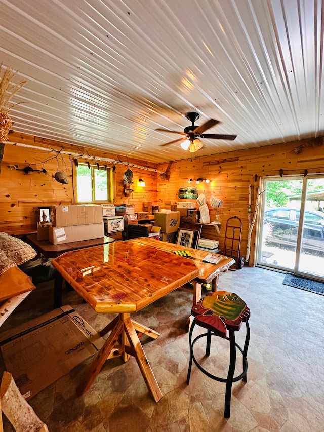 1414 E Shore Dr, Edgewater, WI 54817 - dining room featuring wooden walls, stone finish floors, and ceiling fan