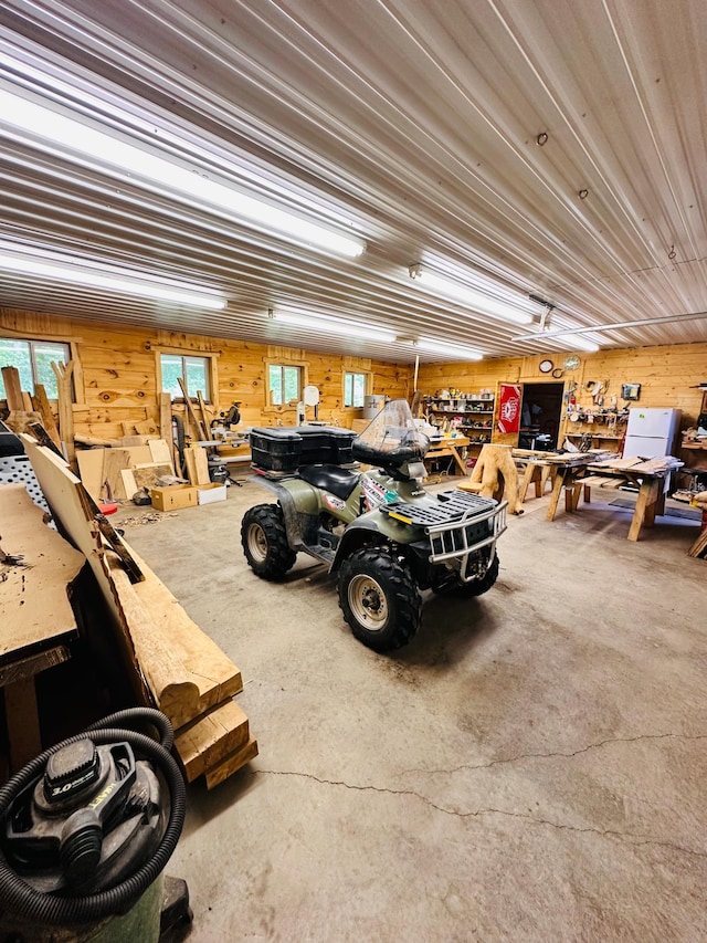 1414 E Shore Dr, Edgewater, WI 54817 - garage featuring wood walls and a workshop area