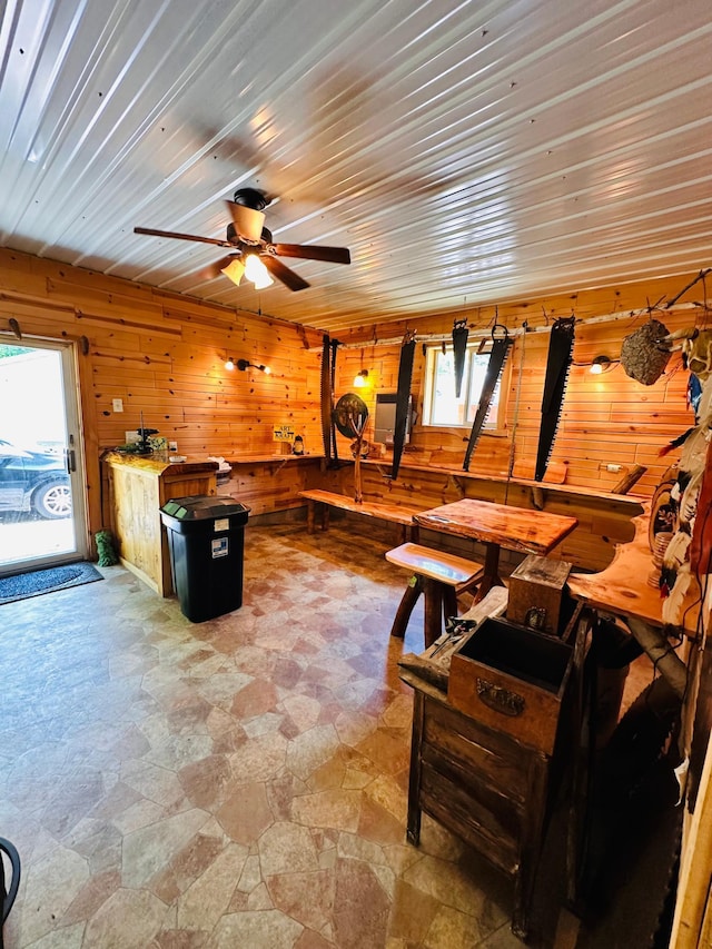 1414 E Shore Dr, Edgewater, WI 54817 - living room with light stone finish floors, healthy amount of natural light, wood walls, and ceiling fan