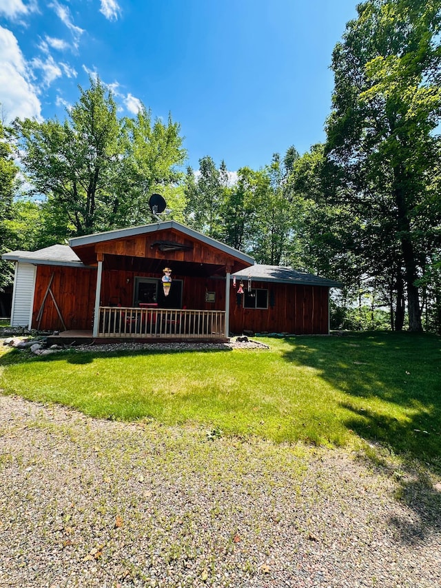 1414 E Shore Dr, Edgewater, WI 54817 - rustic home with a front yard and a porch