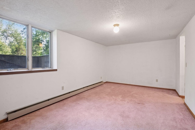 29908 108th St NW, Baldwin Twp, MN 55371 - empty room with a baseboard heating unit, light colored carpet, and a textured ceiling