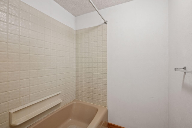 29908 108th St NW, Baldwin Twp, MN 55371 - bathroom with a textured ceiling and washtub / shower combination