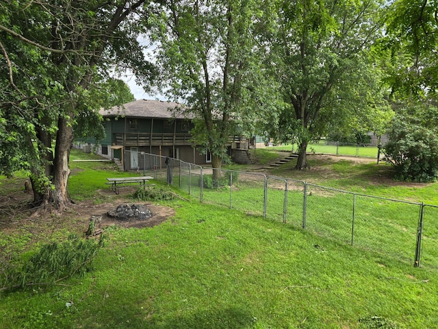 29908 108th St NW, Baldwin Twp, MN 55371 - view of yard featuring a wooden deck and an outdoor fire pit