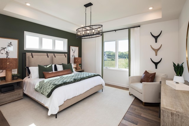 14643 107th Pl N, Maple Grove, MN 55369 - bedroom featuring wood finished floors, recessed lighting, a tray ceiling, and a chandelier