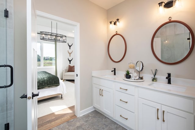 14643 107th Pl N, Maple Grove, MN 55369 - ensuite bathroom featuring double vanity, a tile shower, and stone finish flooring