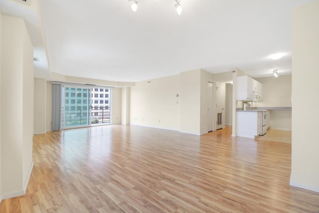 66 9th St E Unit 1315, Saint Paul, MN 55101 - unfurnished living room with light wood finished floors