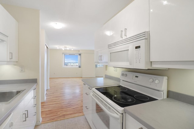 66 9th St E Unit 1315, Saint Paul, MN 55101 - kitchen featuring white appliances, white cabinetry, and light countertops