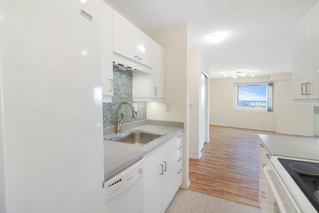 66 9th St E Unit 1315, Saint Paul, MN 55101 - kitchen with white appliances, light countertops, decorative backsplash, and white cabinets