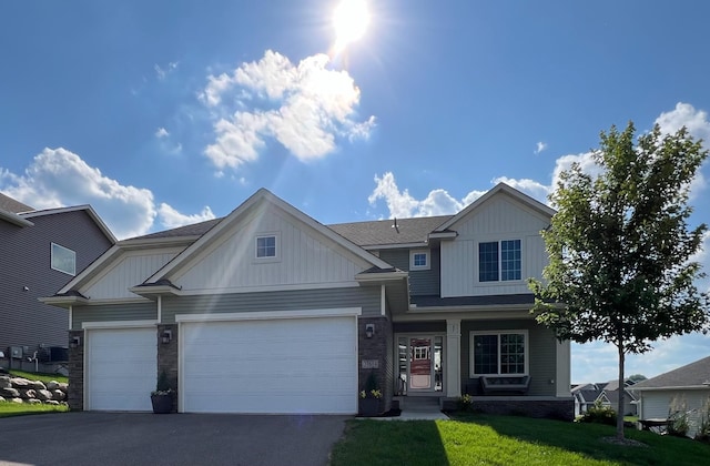 27614 Kaden St, Elko New Market, MN 55020 - craftsman-style home featuring driveway, a front lawn, and an attached garage