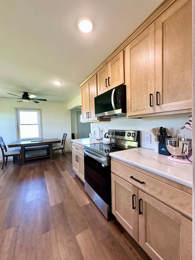 1555 US Highway 75, Lake Benton Twp, MN 56149 - kitchen featuring stainless steel range with electric cooktop, light brown cabinetry, light countertops, ceiling fan, and dark wood-type flooring