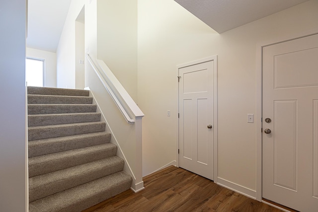 12051 Owatonna Ct, Blaine, MN 55449 - stairway with wood finished floors and baseboards