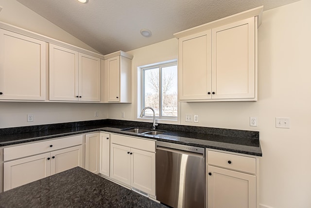 12051 Owatonna Ct, Blaine, MN 55449 - kitchen with stainless steel dishwasher, vaulted ceiling, white cabinetry, dark stone counters, and a textured ceiling