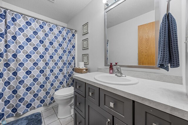 817 16th Avenue Ct W, West Fargo, ND 58078 - bathroom featuring vanity, tile patterned floors, a textured ceiling, and a shower with curtain