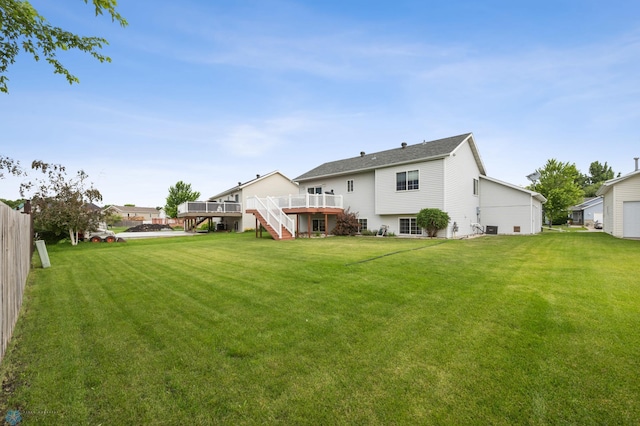 817 16th Avenue Ct W, West Fargo, ND 58078 - rear view of property featuring stairway and a wooden deck