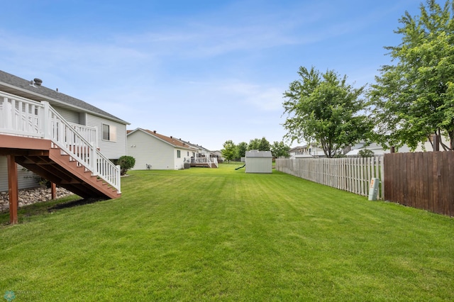 817 16th Avenue Ct W, West Fargo, ND 58078 - view of yard featuring stairs, a wooden deck, and a shed