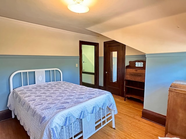 221 3rd St, Moose Lake, MN 55767 - bedroom with lofted ceiling and wood finished floors