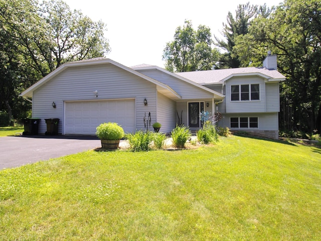 237 Plainview Dr, Troy Twp, WI 54022 - tri-level home featuring a garage, asphalt driveway, a chimney, and a front lawn