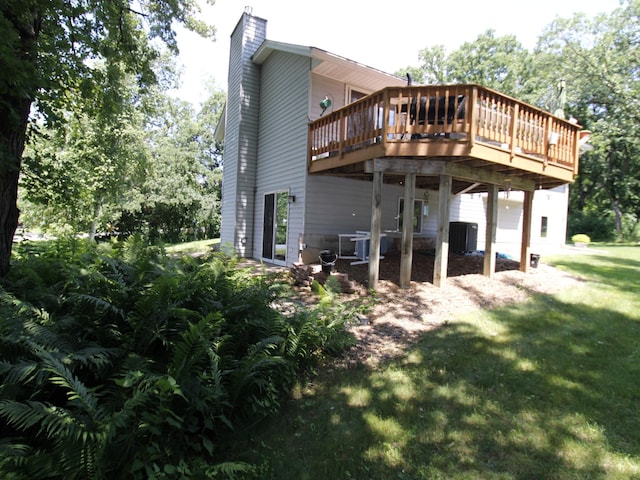 237 Plainview Dr, Troy Twp, WI 54022 - rear view of property with a chimney, a wooden deck, and a yard