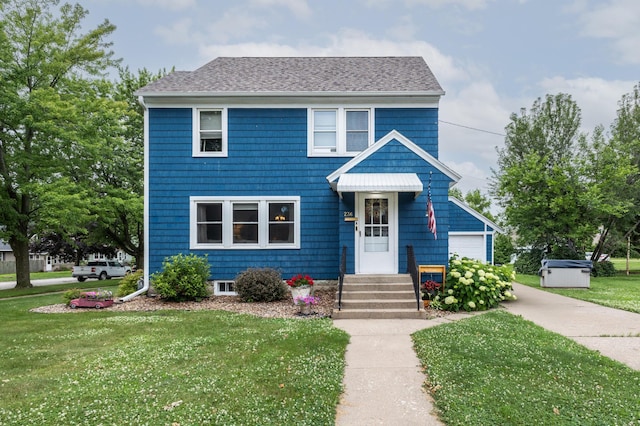 236 Alleghany Ave, Wabasha, MN 55981 - view of front of property with a front lawn, roof with shingles, and a garage