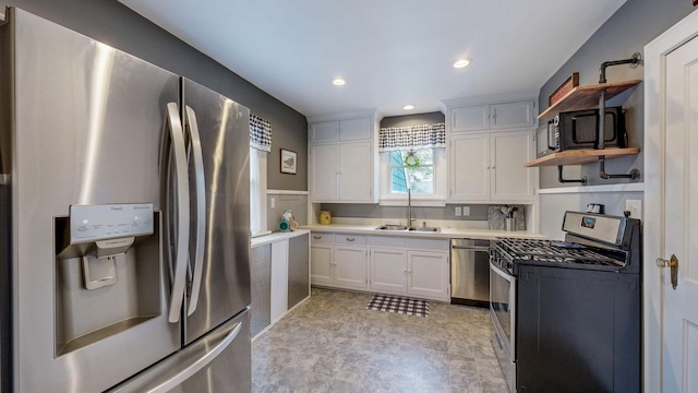 236 Alleghany Ave, Wabasha, MN 55981 - kitchen featuring appliances with stainless steel finishes, open shelves, white cabinetry, light countertops, and recessed lighting