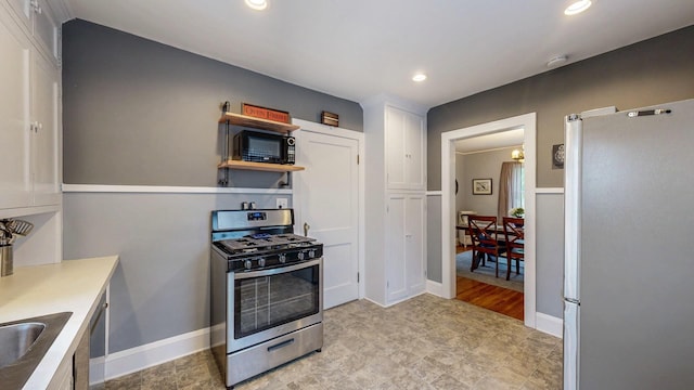 236 Alleghany Ave, Wabasha, MN 55981 - kitchen featuring stainless steel appliances, white cabinetry, recessed lighting, and light countertops