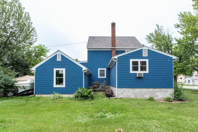 236 Alleghany Ave, Wabasha, MN 55981 - rear view of house featuring a chimney and a yard