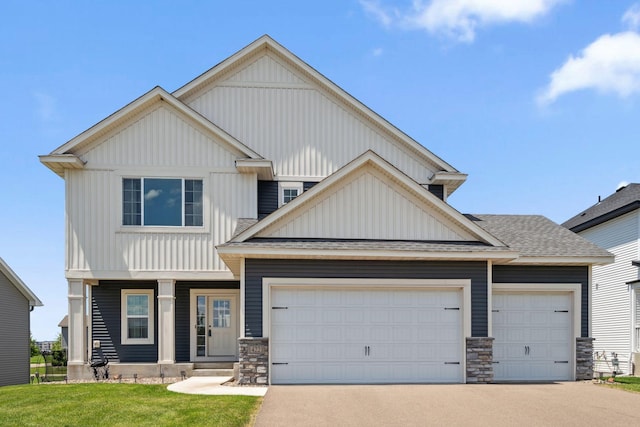 14221 Aspen Ave, Rosemount, MN 55068 - craftsman-style house featuring a garage, concrete driveway, a front yard, board and batten siding, and stone siding