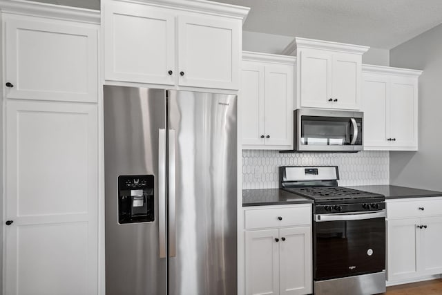 14221 Aspen Ave, Rosemount, MN 55068 - kitchen with stainless steel appliances, dark countertops, white cabinetry, and backsplash