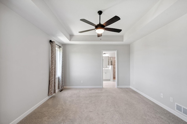 14221 Aspen Ave, Rosemount, MN 55068 - spare room with a ceiling fan, a tray ceiling, and light carpet