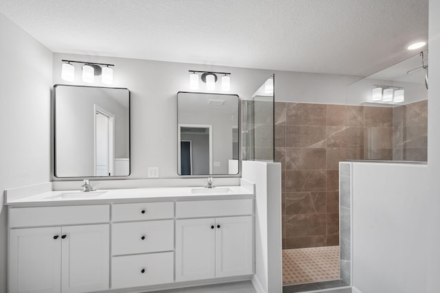 14221 Aspen Ave, Rosemount, MN 55068 - bathroom featuring walk in shower, double vanity, and a textured ceiling