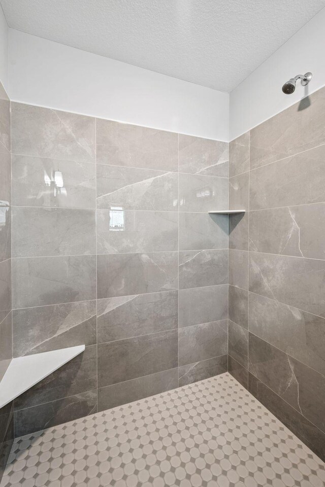 14221 Aspen Ave, Rosemount, MN 55068 - full bathroom with tiled shower and a textured ceiling