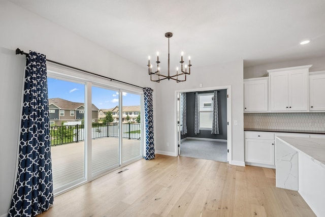 14221 Aspen Ave, Rosemount, MN 55068 - unfurnished dining area featuring a chandelier, light wood-style floors, a water view, and recessed lighting